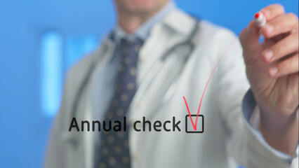 Doctor ticking a checkbox on a virtual screen for an annual checkup, marking the successful...