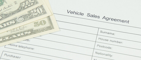 Form of vehicle sales agreement and dollar banknotes. Sales, purchases new or used vehicle