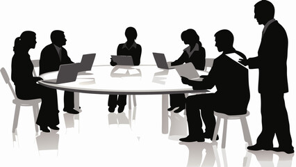 Silhouette of group of people sitting around a round table with laptops and documents in a meeting room