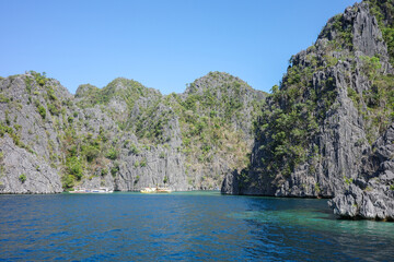 Naklejka premium A beautiful scenery of Coron, Palawan, Philippines. The amazing mountain range and deep blue ocean, the absolute paradise for island lovers in Asia