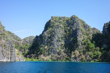A beautiful scenery of Coron, Palawan, Philippines. The fertile mountain range and deep blue ocean,...