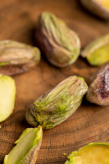pistachios chopped and crushed into pieces of different sizes, a bunch of green crunchy pistachios, close up