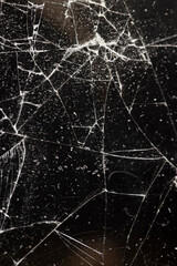 broken glass on a black background, glass broken into many pieces