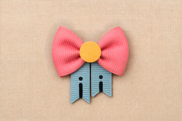 Cute Pink and Blue Fabric Bow with Yellow Center