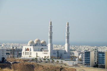 Oriental architecture. A white Arab city in the foothills against background of dry desert...