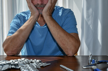 Man visits a Clinic for Drug addiction and psychotic disorder.  A doctor gives medication advice and support for substance abuse. Desperate and in despair his mental health is suffering.