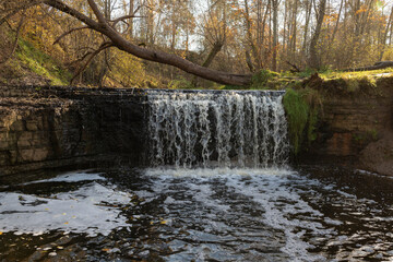 View of Sablinsky Waterfall on a sunny October day. Ulyanovka, Leningrad Oblast, Russia