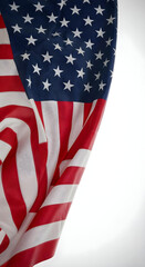 Obraz premium U.S. flag waving gracefully on white background, highlighting vibrant colors and flowing fabric.