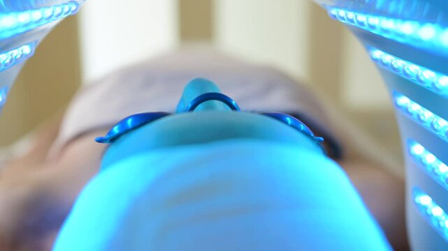 Woman undergoing led light therapy for facial skin rejuvenation