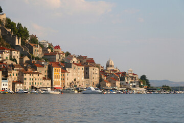 Fototapeta premium Historical buildings and boats on the coast of Sibenik, Croatia.