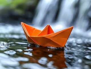 Orange Paper Boat Floating on Waterfall Stream