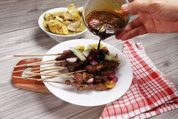 chicken satay on plate