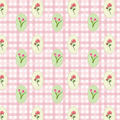 Pattern con sfondo a quadretti rosa e ovali con fiori colorati