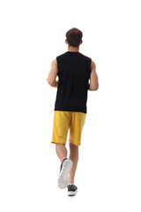 Sporty young man running marathon on white background, back view