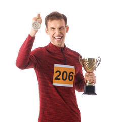 Young man with gold cup and third place medal after running marathon on white background