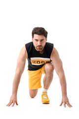 Sporty young man in crouch start position for marathon on white background