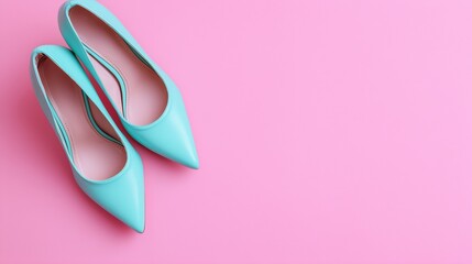 Stylish turquoise high heel shoes on a vibrant pink background for fashion enthusiasts