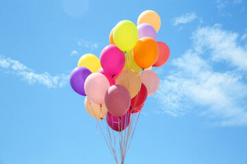 Many colorful air balloons on cloudy sky background