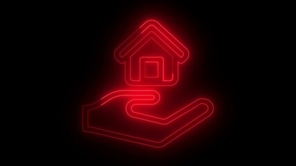 Illuminated red neon house icon held in a hand depicting home ownership insurance and real estate concepts on a black background