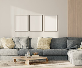 Three blank frames in lounge interior with blue sofa and table with wooden panel on the wall, 3d render