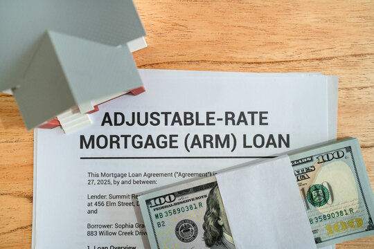 Top view of mortgage contract with adjustable interest rates. Concept of good debt for investing in real estate.
