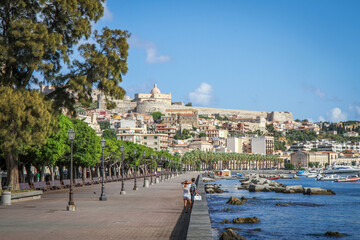 A Mediterranean coastal city with a waterfront, historic architecture and a harbor in Italy.