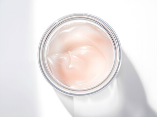 Top view of open skincare cream in glass jar with soft light shadow, perfect for beauty or skincare product marketing. Generative AI