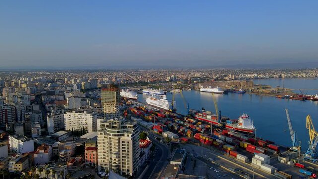 Aerial View of Cargo Containers, Passenger Ferries, and Shipping Operations at Port Terminal