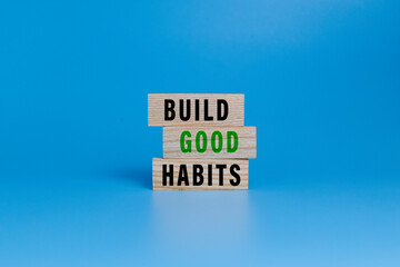 build good habits words symbol on wooden blocks isolated on white ang green background. motivational words concept