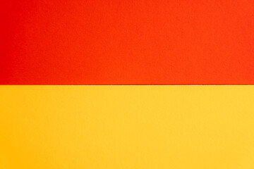 Horizontal layout of orange and yellow paper with clean separation. High quality photo