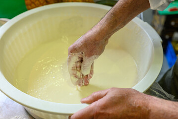 food preparation hands mixing ingredients to create a perfect dough texture