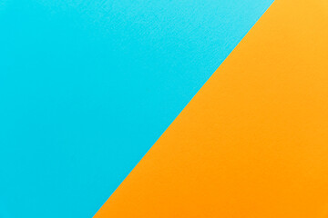Cyan and orange paper with clean lines, graphic minimal background. High quality photo