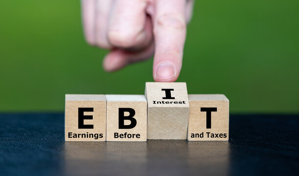 Cubes form the acronym EBIT (Earnings Before Interest and Taxes).