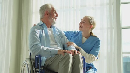 Help support retirement healthcare. Nurse helping old man in wheelchair. Patient and woman in nursing home for medical caregiver. Nurse taking care of paralyzed man in chair for people with disability - Powered by Adobe