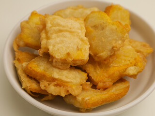 Fried tofu in white plate on white background