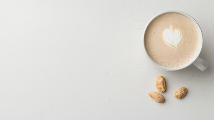 Minimalist top-down view of a cappuccino with heart-shaped latte art and scattered nuts on a clean white background. A calm, cozy setup perfect for cafe branding or morning coffee themes.