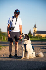 happy man and white dog