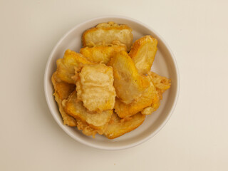 Fried tofu in white plate on white background