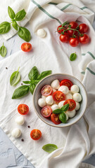 FlatLay with Mozzarella Balls, Cherry Tomatoes and Basil on White Linen
