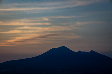 Silhouette of Vesuvius volcano at sunset. Copy space
