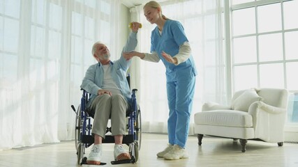 Support rehabilitation healthcare. Nurse helps old man patient in wheelchair picking up dumbbells. Paralyzed man in chair for people with disability doing sports exercise with nurse. Medical caregiver - Powered by Adobe
