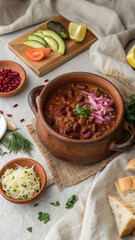 FlatLay of Georgian Lobio with Pickled Vegetables and Cornbread (Mchadi)
