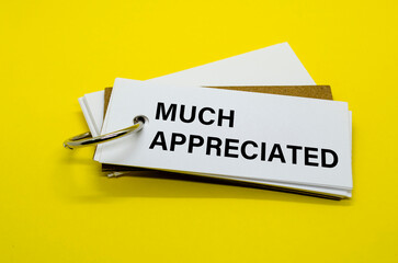 Note with Much Appreciated text clipped to a yellow card