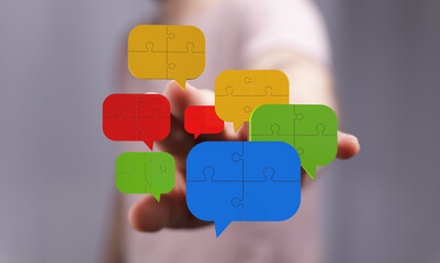 Abstract image of puzzle pieces forming speech bubbles, representing communication and...