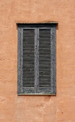 An old wooden window with worn paint.