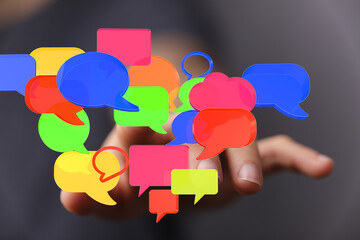 Hand interacting with vibrant speech bubbles,communication, social media, networking concept.