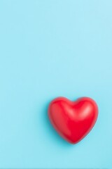 Red heart on light blue background