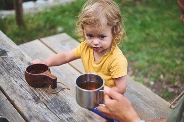 Young Child Enjoying Outdoors with Family on a Sunny Day