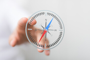 SEO-friendly image of a hand holding a digital compass, ideal for business, navigation, and...