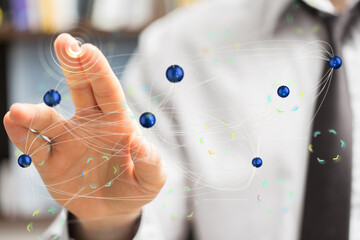 Hand interacting with a digital network, representing global connections and communication.